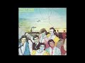01  SPLIT ENZ 1975 walking down a road