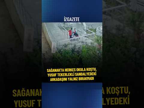 SAĞANAKTA HERKES OKULA KOŞTU, YUSUF TEKERLEKLİ SANDALYEDEKİ ARKADAŞINI YALNIZ BIRAKMADI #haber
