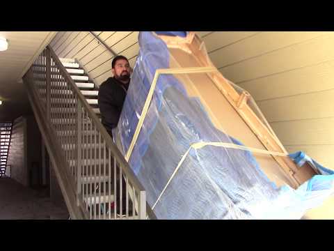 Part of a video titled How to Move a Heavy Dresser Upstairs By a Professional Mover