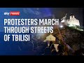 Demonstrators march through Tbilisi, Georgia, in protest over 'foreign agents' bill
