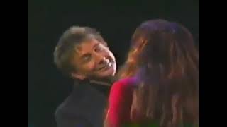 Barry Manilow and Donna Summer performing the song Could it Be Magic