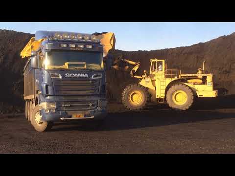 Old Caterpillar 992B Wheel Loader Loading Coal On Trucks