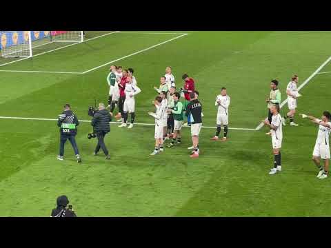 Legia Warsaw fans salute their team after win at Chelsea
