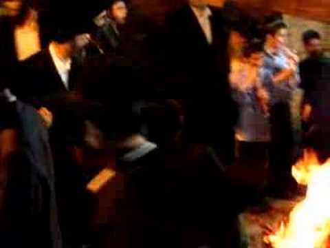 Pouring oil on the fire in honor of rabbi shimon Bar Yochai Lag Baomer