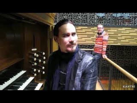 Tuomas Holopainen playing church organ.