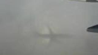 Shadow of 737 off of Clouds