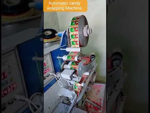 Automatic candy wrapping machine
