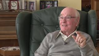A gentleman telling a story from his armchair