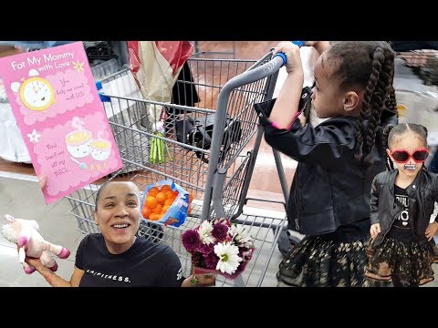 Cute Little Girl Doing Shopping At The Supermarket for Mother's Day Gift Surprise!
