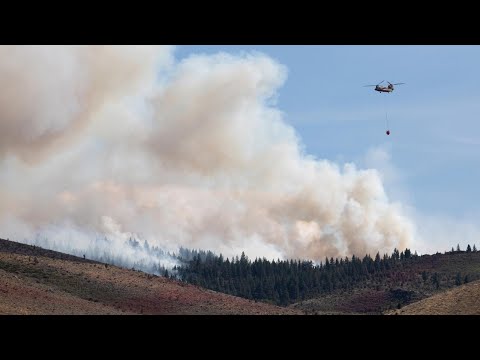 Firefighters battle flames and smoke near Reno fueled by drought and wind