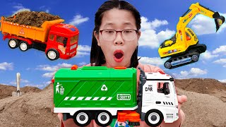 Cranes, excavators, bulldozers help garbage trucks