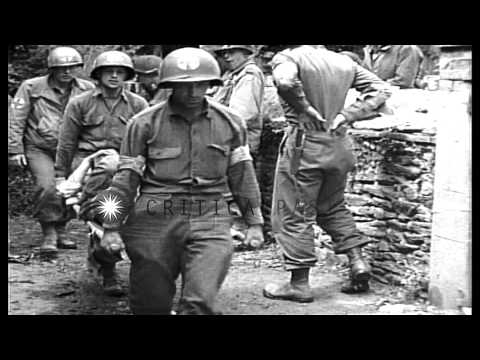 United States 35th Infantry Division soldiers enter St. Lo, France during World W...HD Stock Footage