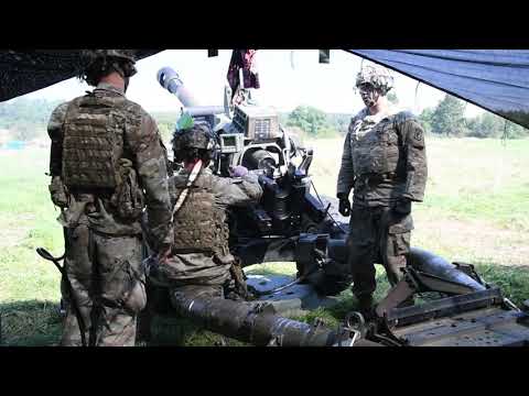 4-319th FA, 173rd Airborne Brigade, fire a M119 105mm howitzer during a live fire exercise