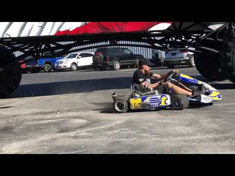 Drifting Under Monster School Bus with 180cc shifter kart.