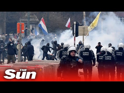 Belgium Covid-19 protesters throw projectiles at riot police retaliate with water cannons