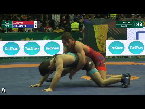 Round 2 FS - 65 kg: H. ALIYEV (AZE) df. I. JULAKIDZE (GEO) by TF, 12-0