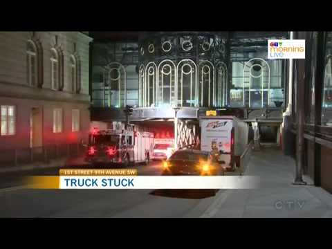 Truck crashes into bridge in downtown core