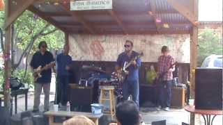 Brendon playing the blues with a band at Oma Gruene's Secret Garden at Gruene Hall, Texas