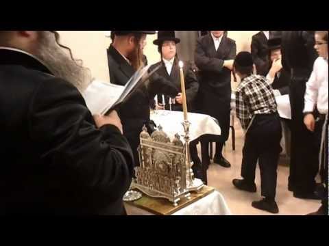Nadvorna rabi from Elad lighting Hanukkah candles