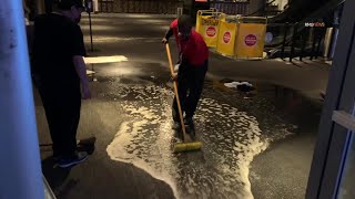 Heavy rain floods the entrance of the Microsoft Theatre in Downtown LA.