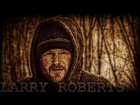 splitting wood with a saw