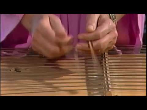 Constance Demby playing the hammered dulcimer
