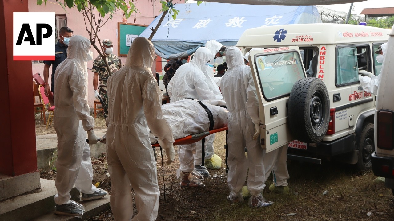 Video: Nepal district authorities begin temporary burials of flood victims after DNA sampling