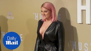 Meghan Trainor flaunts figure in a plunging leather jumpsuit