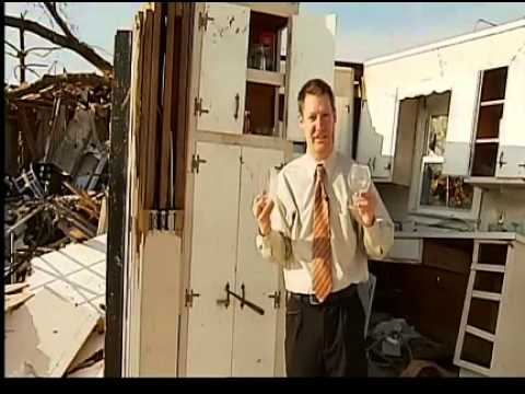 Tornado victim is reunited with her cat.