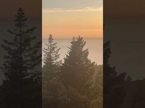 Watching the sun set over the Pacific Ocean.