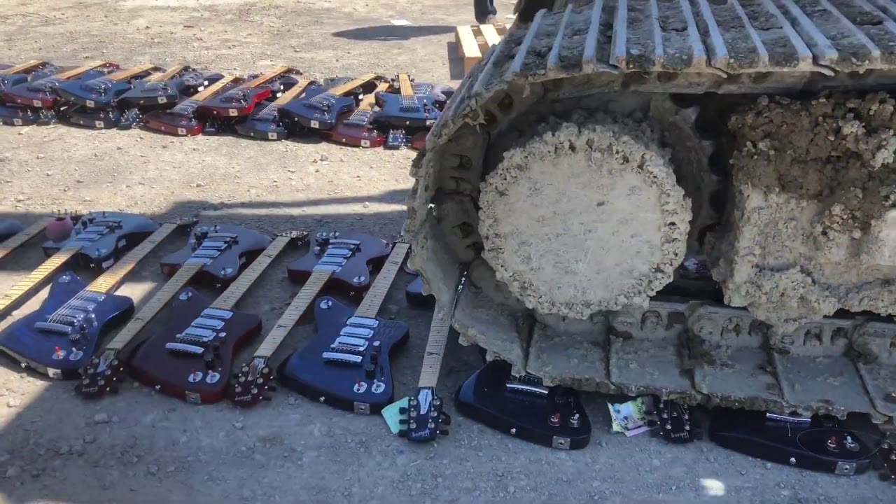 Excavator DESTROYS $500,000 Hundreds of BRAND NEW Gibson Firebird X Guitars! - YouTube