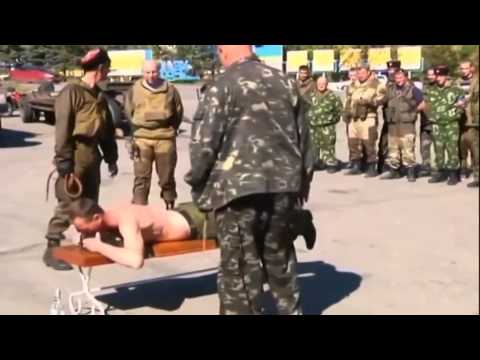 Russian Cossack Insurgents Whip Troops: Corporal punishment staged to deter drunken lawlessness