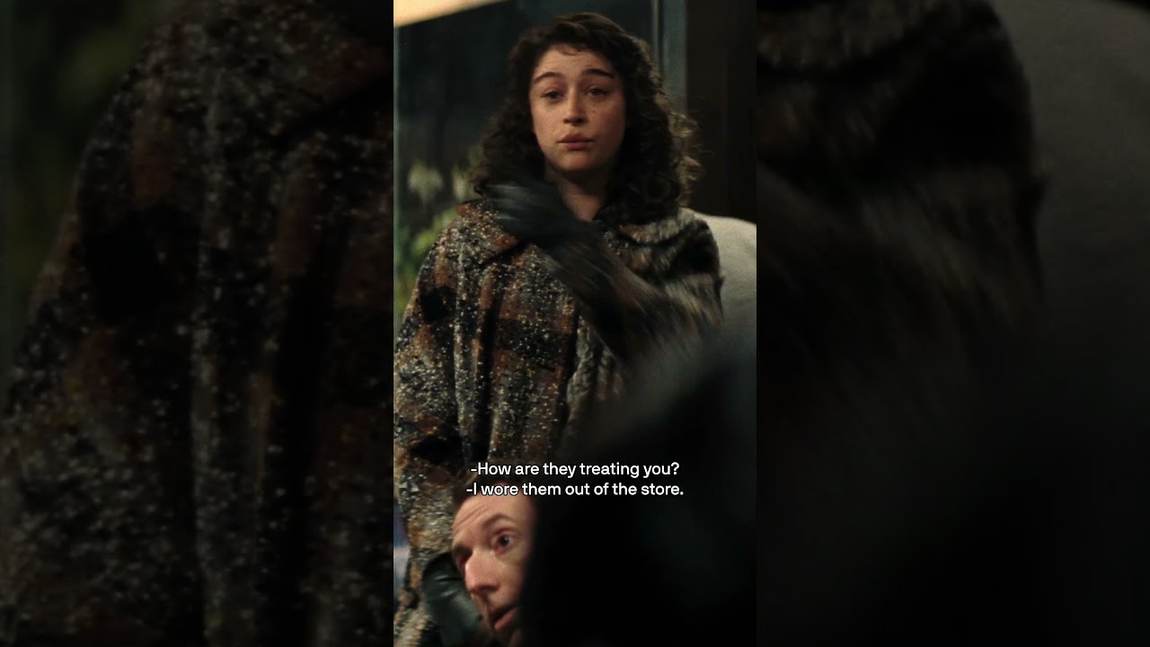 Him, with the glasses.