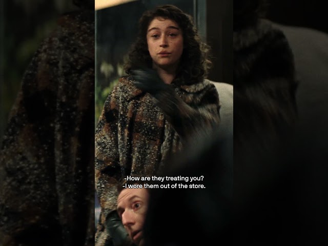 Him, with the glasses.