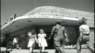 Shoppers enter and leave Sixth Street Market in North Platte, Nebraska. HD Stock Footage