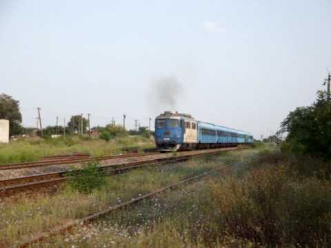 ROMANIAN SULZER 60-0864-3 WITH A PASSENGER TRAIN