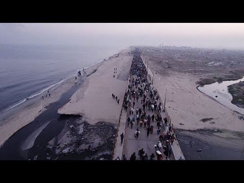 Tens of thousands return to devastated northern Gaza as Israel lifts its closure under truce