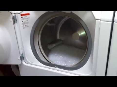 Running a front loading washer with the door open.