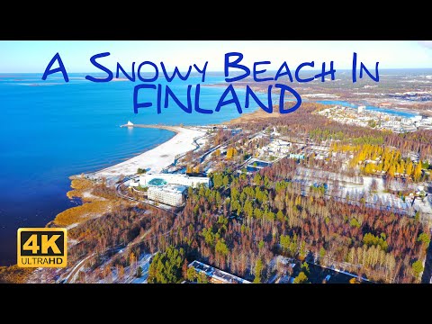 A snowy beach in Finland at the end of the Autumn | 4K Drone Video
