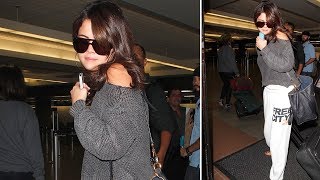 Selena Gomez Arrives At LAX In Sweatpants After Long Flight From Venice [2012]