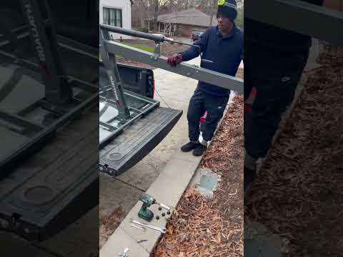 Installed Goaliath hoop behind a retaining wall.