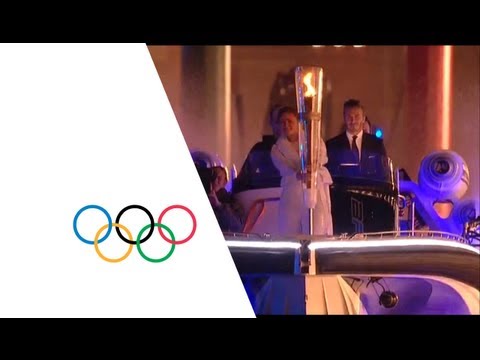 David Beckham & Sir Steve Redgrave Pass Olympic Torch - London 2012 Opening Ceremony