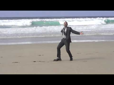 happy businessman dancing on the beach slow motion shot at 60fps 4jgdh1hjx  D