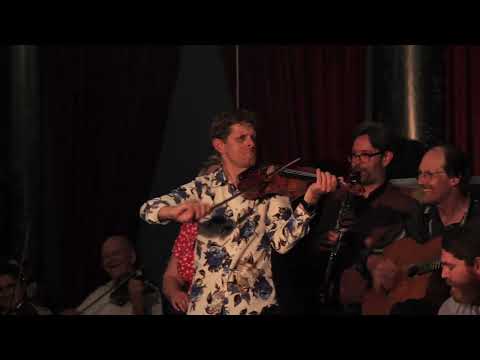 Django and Grappelli's Minor Swing by 65 players, with original 1937 solos!