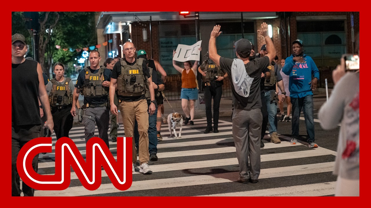 Crowd in DC outraged by federal law enforcement presence as cars stopped on busy street