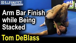 How to Execute an Arm Bar Finish When You’re Being Stacked, According to Tom DeBlass