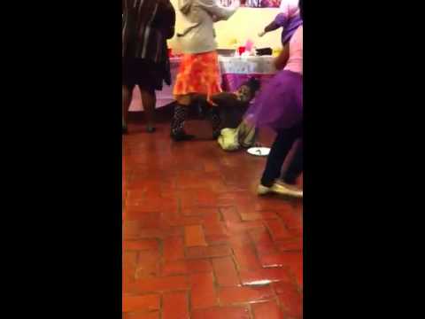 Lamia and the cake. At Samyra 7th birthday party.