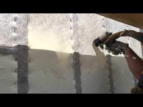 Installing Profill Open Cell Spray Foam in a wall cavity