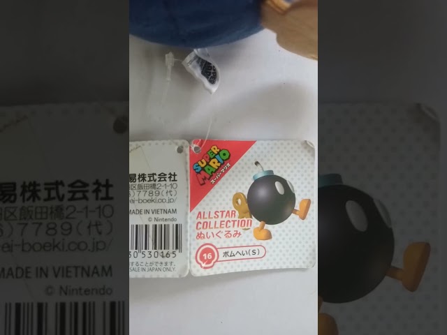 Vídeo relacionado con Super Mario-Bob-Omb Mario Sanei-Peluche con Licencia Oficial, Multicolor, 12 cm AC16
