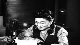 Iva Toguri D&#39;Aquino (Iva Ikuko Toguri) reads propaganda from Radio Tokyo and talk...HD Stock Footage